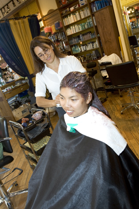Young female at a hair salon with a hairdresser.